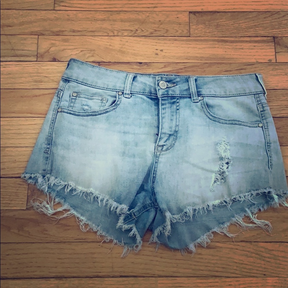 Celebrity pink. Light wash fringe jean shorts